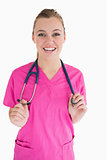 Smiling doctor with pink scrubs