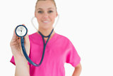 Woman holding a stethoscope