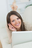 smiling woman using her laptop