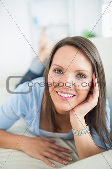 Woman looking happy on sofa