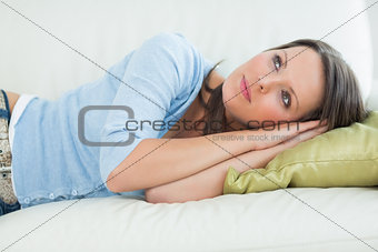 Resting woman lying on the sofa