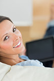 Smiling woman using her laptop