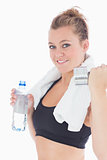 Woman holding weights and a bottle of water