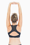 Woman stretching arms reverse
