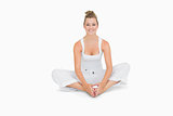 Woman sitting in bound angle yoga pose
