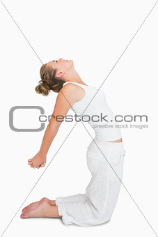 Woman in camel yoga pose