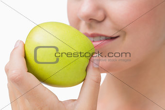 Woman about to eat apple