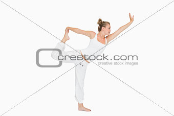 Girl in lord of the dance yoga pose