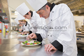 Chef's preparing their salads