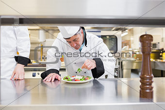 Chef garnishing his salad