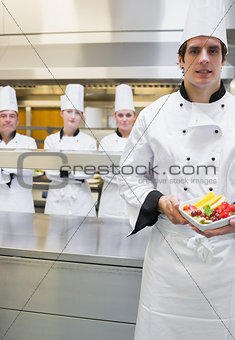 Chef presenting fruit salad