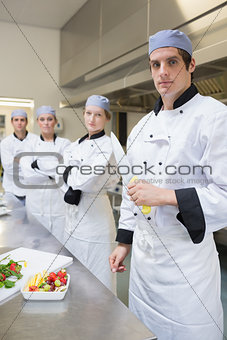 Chef looking stern holding a knife