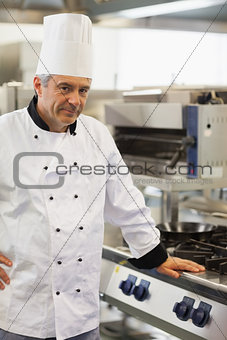 Chef leaning against the stove