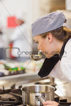 Chef smelling her soup