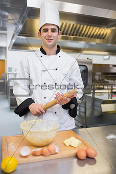 Pastry chef holding rolling pin