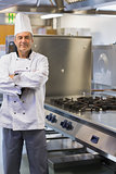 Chef smiling while standing in the kitchen
