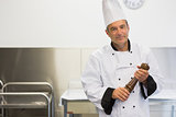 Chef holding a pepper mill