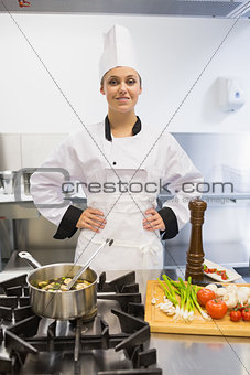 Chef smiling while cooking soup