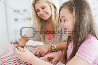 Woman and child holding a tablet computer