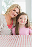 Mother and daughter at kitchen table
