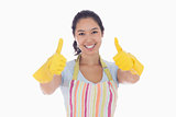 Woman in rubber gloves giving thumbs up