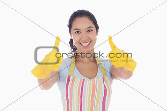 Woman in rubber gloves giving thumbs up