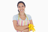 Woman smiling and holding rubber gloves