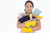 Woman holding heavy cleaning tools