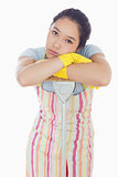 Frowning woman leaning on mop