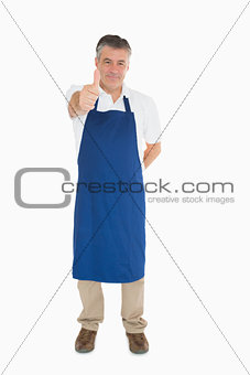 Man in apron giving thumbs up
