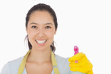 Smiling woman with spray bottle