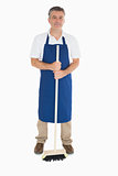 Man in apron with brush
