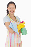 Happy woman holding cleaning products