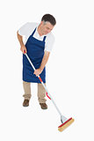 Man mopping the floor