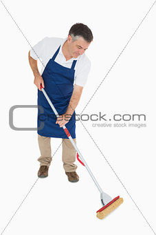 Man mopping the floor