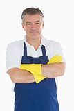 Man in apron wearing rubber gloves