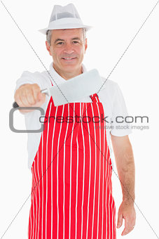 Butcher holding big meat cleaver