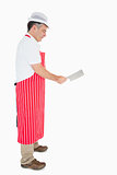 Butcher using meat cleaver