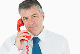 Businessman on red phone