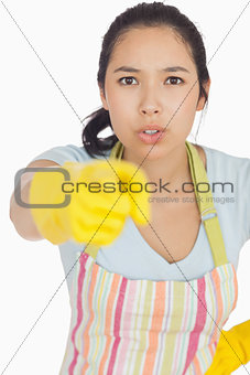 Accusing woman in apron pointing