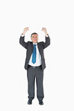 Businessman with hands up