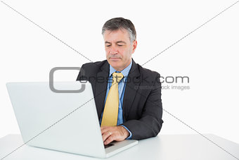 Man writing on his laptop