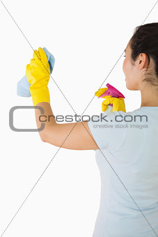 Woman cleaning walls