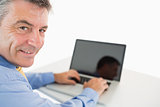 Happy man working with laptop