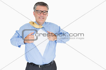 Happy man with glasses is pulling his shirt with his hands