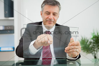 Happy man pointing on his virtual screen