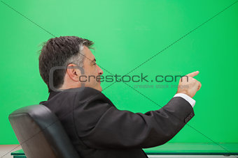 Well-dressed man pointing to a copy space