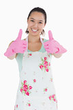 Happy woman in rubber gloves giving thumbs up