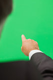 Man pointing to green copy space