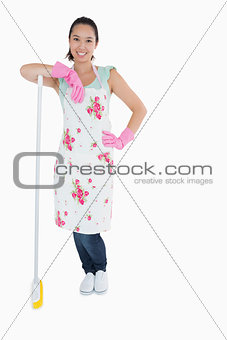 Woman leaning on a broom